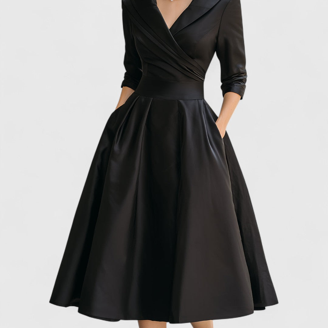 Sophisticated navy blue midi dress for women, a V-neck design with 3/4 sleeves and a flared skirt for any event.