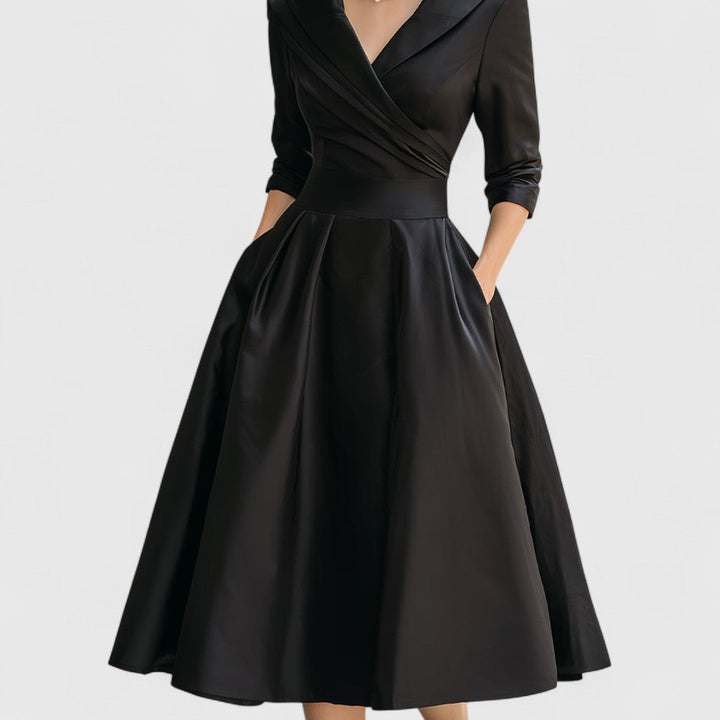 Sophisticated navy blue midi dress for women, a V-neck design with 3/4 sleeves and a flared skirt for any event.