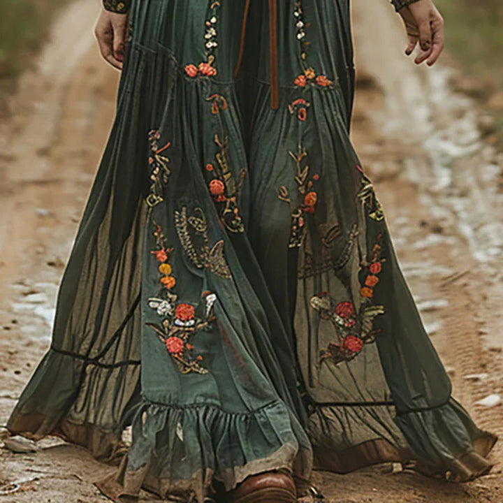 Women's long sleeve boho maxi dress with a V-neck, floral embroidery, and a flattering belted waist