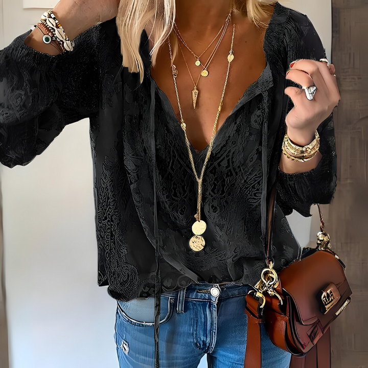 Women's elegant V-neck blouse, a stylish boho top for casual and beach outfits.