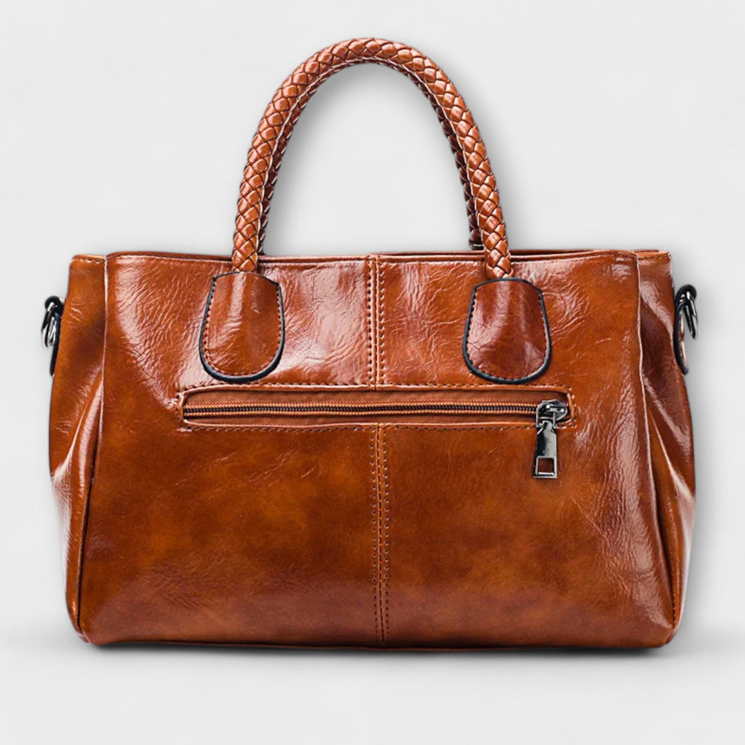 Classic women's shoulder bag with stylish braided handle, a versatile fashion accessory