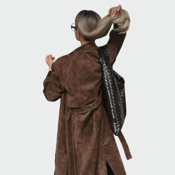 Classic brown trench coat for women, offering a sophisticated and versatile look.