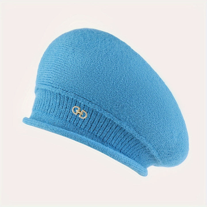 Modern chic women's beret, a warm knitted accessory that combines functionality with classic style.
