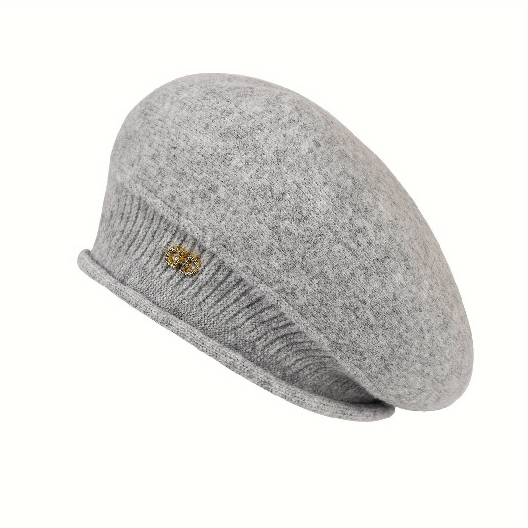 Warm and stylish women's knitted beret, an essential winter accessory for a sophisticated look.