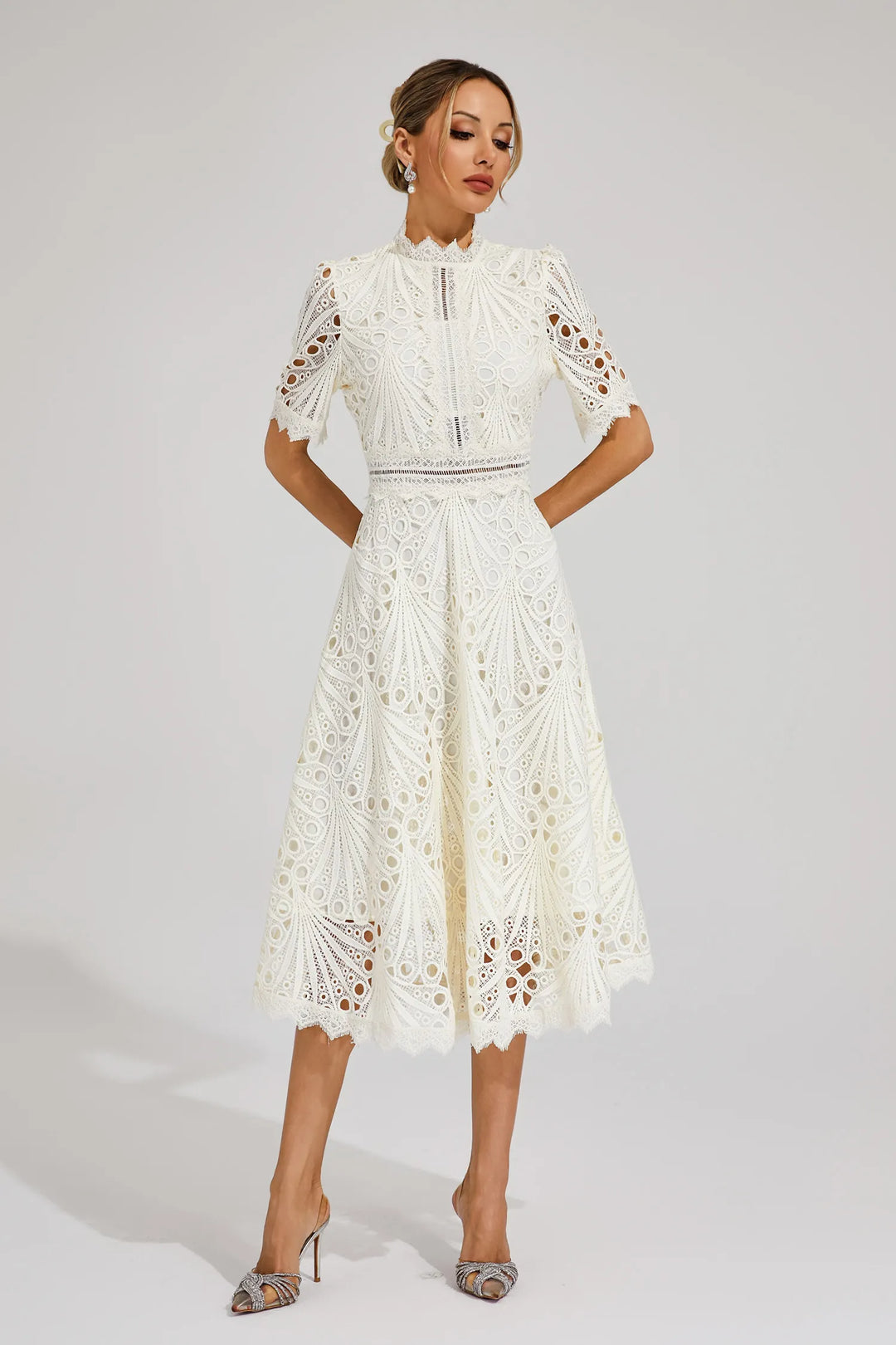 Women's delicate lace midi dress, an ideal choice for special occasions.