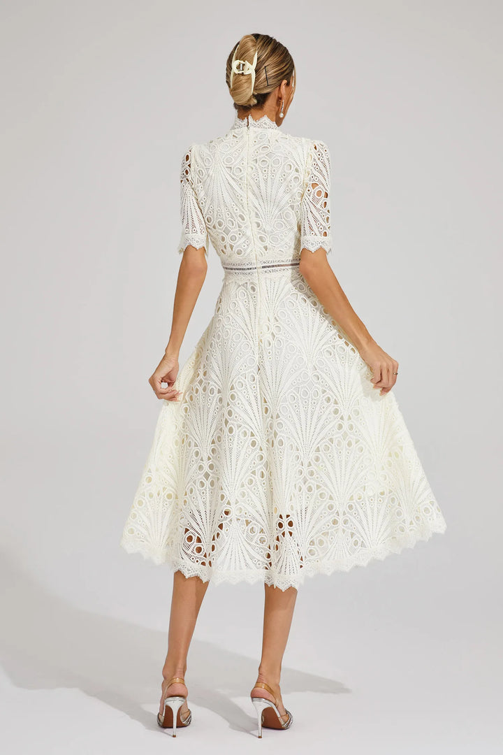 Chic women's midi dress with lace detailing, perfect for evening parties.