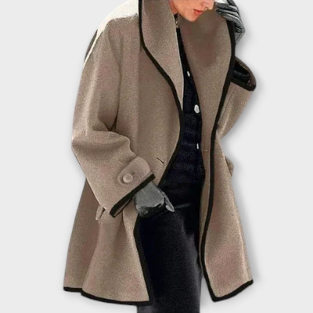 Full-length image of a women's classic trench coat with a neatly tied belt, perfect for fashion.
