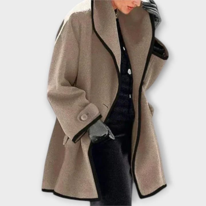Full-length image of a women's classic trench coat with a neatly tied belt, perfect for fashion.