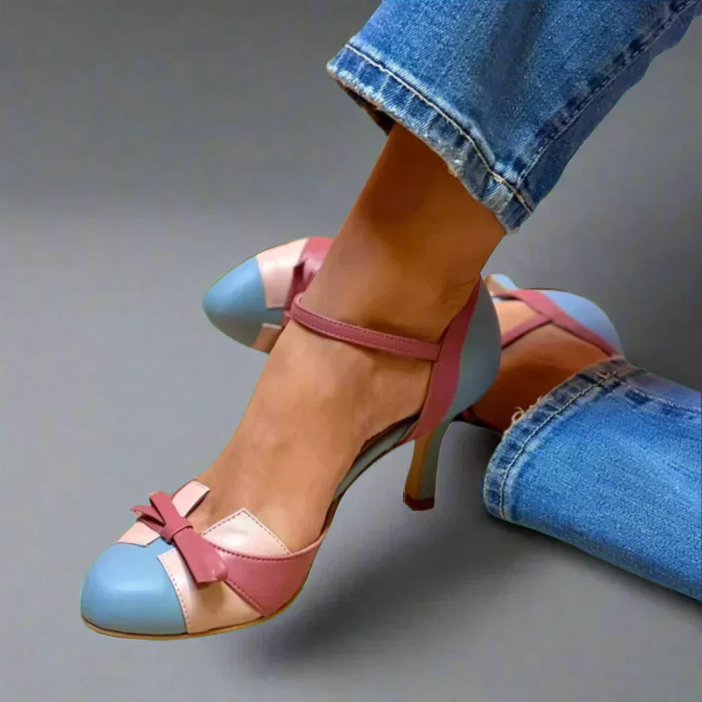 Elegant women's classic bow strap mid heel pumps in a studio shot, ideal for summer outfits