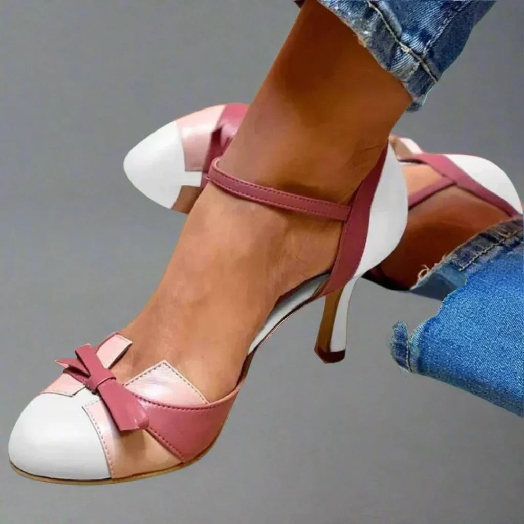 Pair of classic women's bow strap mid heel pumps, showcasing design and suitable for summer fashion