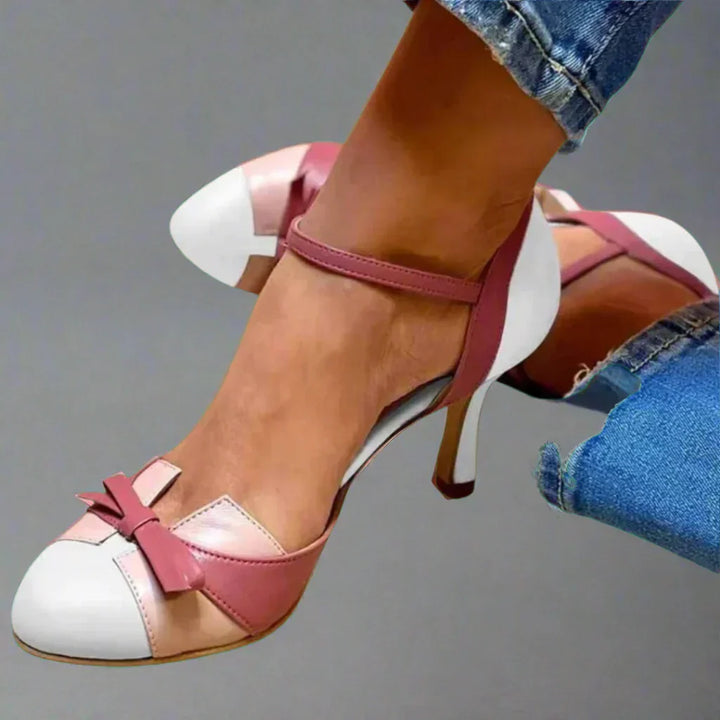 Pair of classic women's bow strap mid heel pumps, showcasing design and suitable for summer fashion