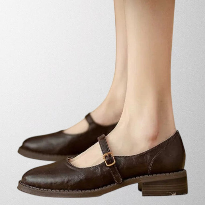Elegant women's classic brown Mary Jane pumps with an ankle strap, perfect for professional wear