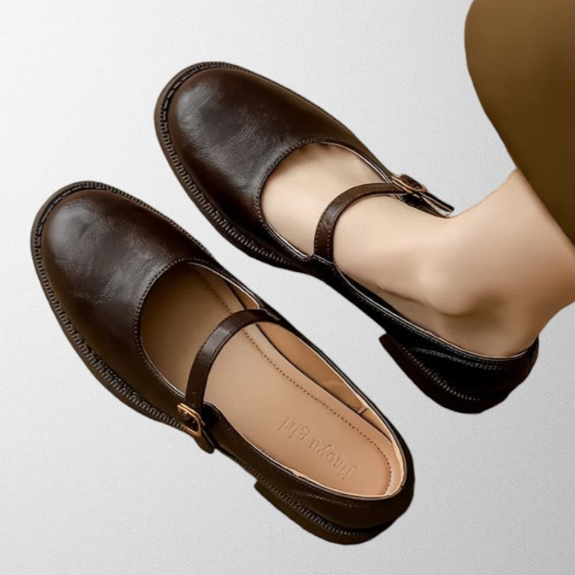 Pair of stylish women's black Mary Jane pumps, showcasing their timeless design and versatility