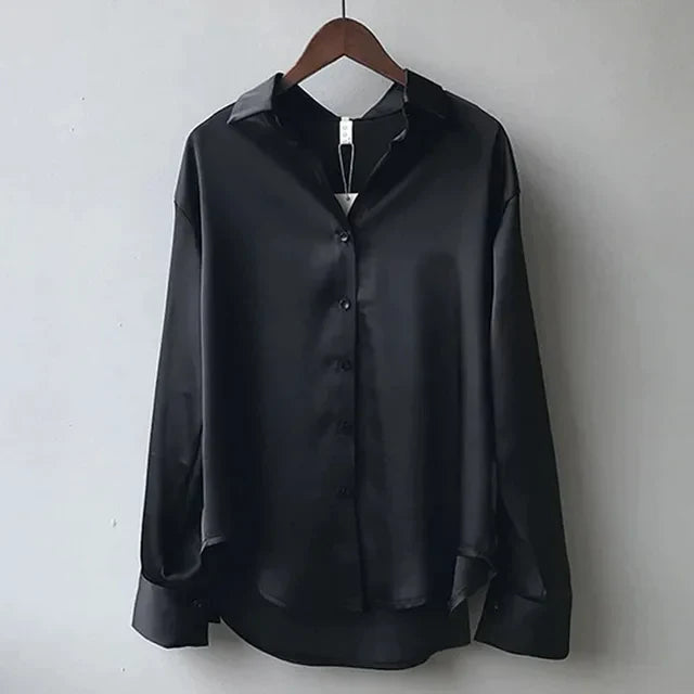 Front view of a women's elegant button-down long sleeve blouse, ideal classic workwear top