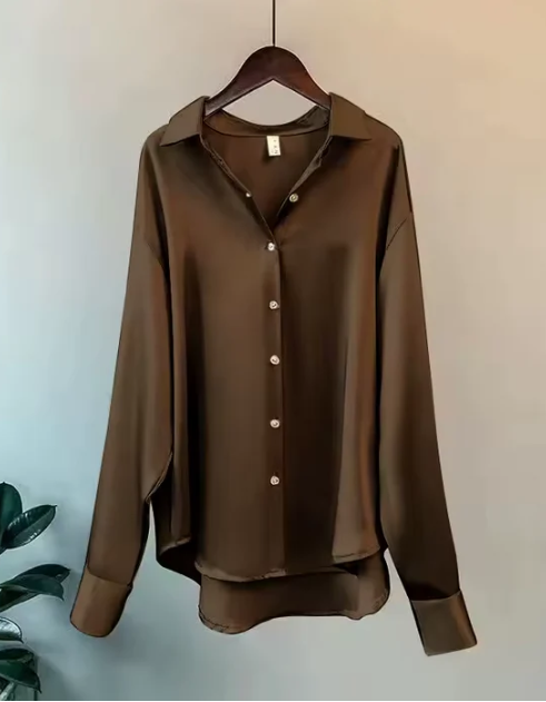 Classic women's summer long sleeve button-down blouse in a light fabric, elegant and casual