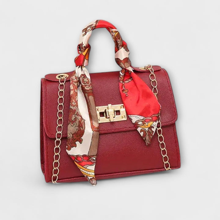Chic women's structured handbag with a elegant chain strap, enhancing any fashion ensemble