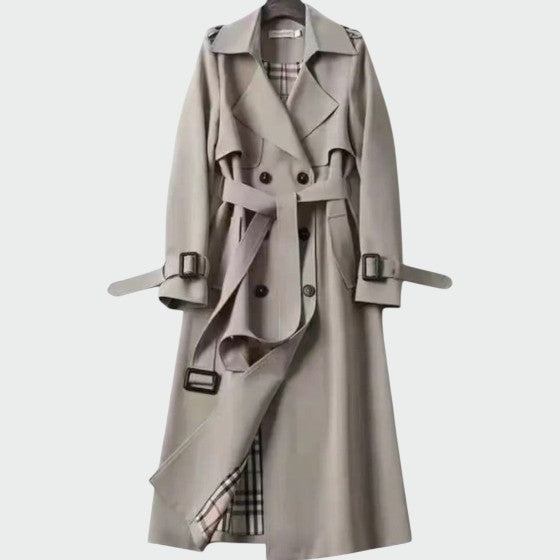 Stylish women's mid-length double-breasted trench coat in classic beige, ideal for autumn fashion
