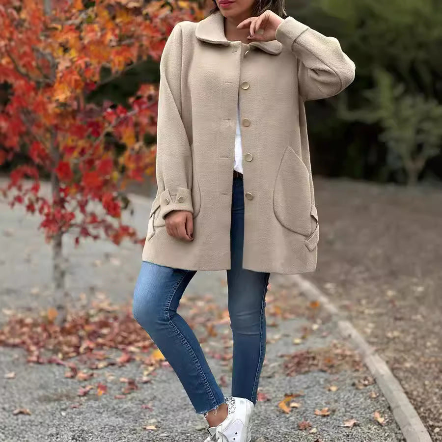 Stylish black oversized mid-thigh women's winter coat, classic silhouette