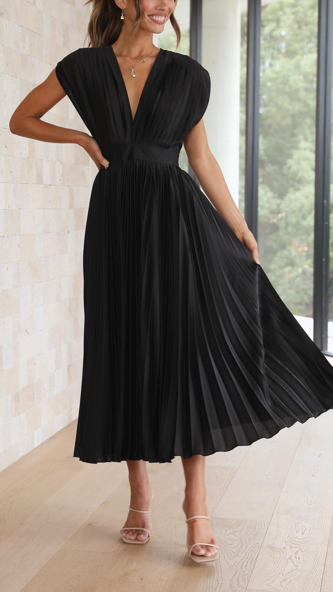 Flowy women's pleated v-neck long dress, showcasing comfort and style.