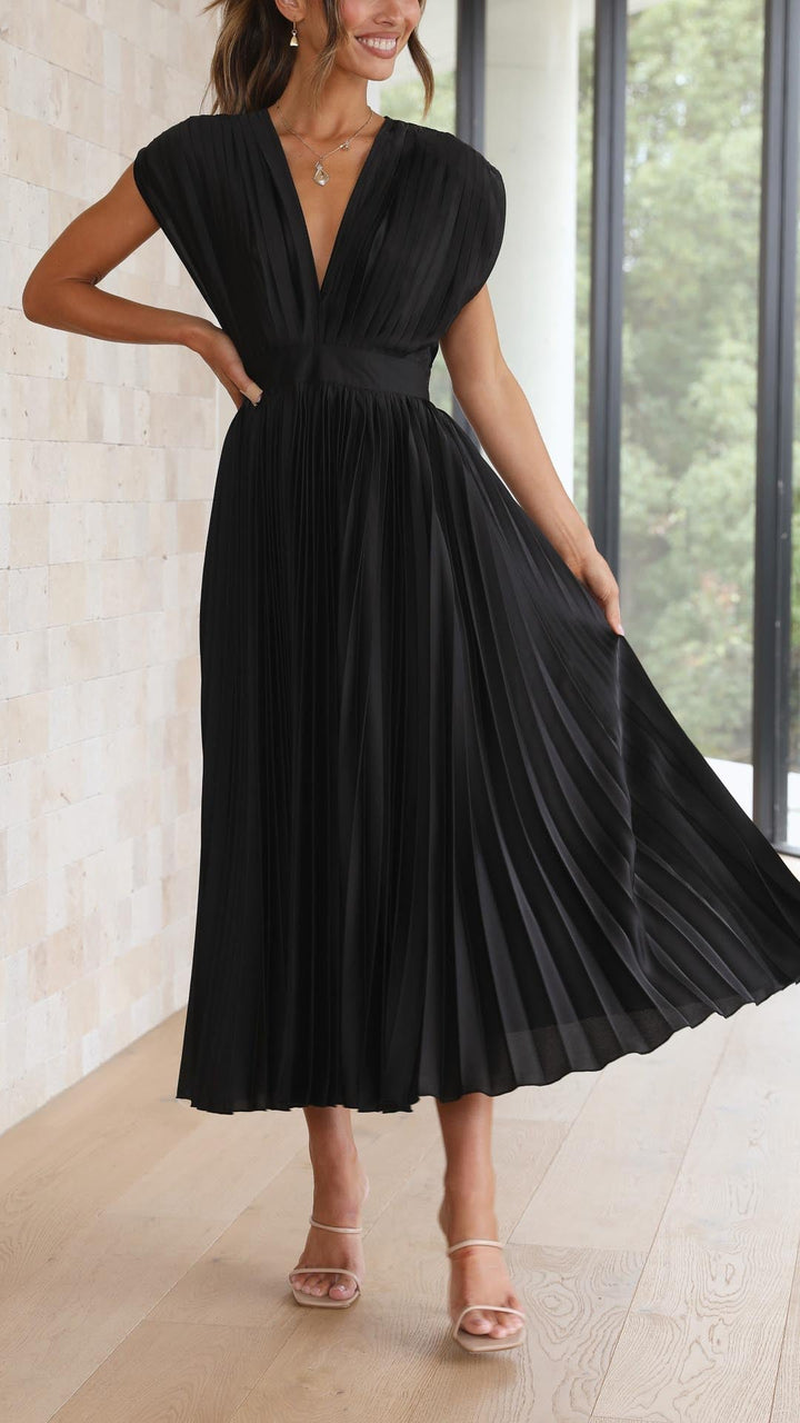 Flowy women's pleated v-neck long dress, showcasing comfort and style.