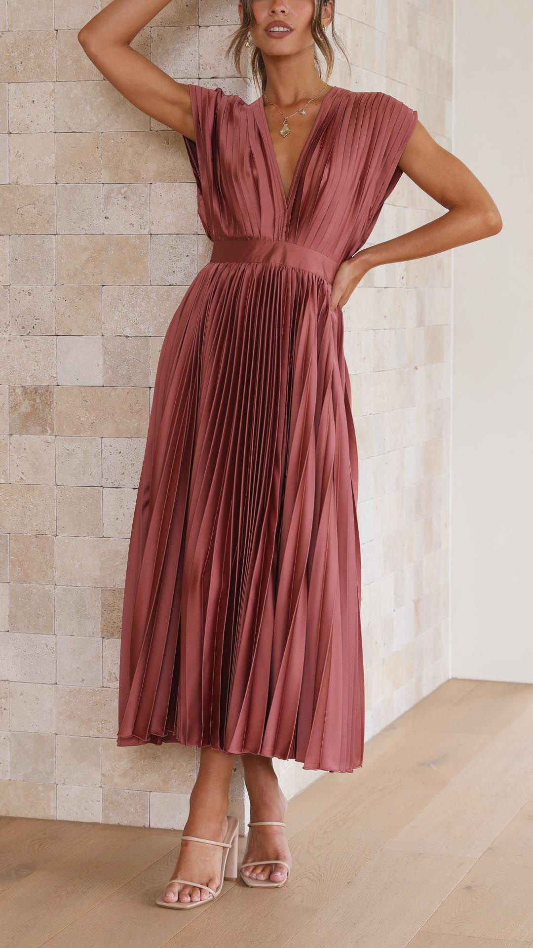 Flowy women's long pleated v-neck dress in a classic style.