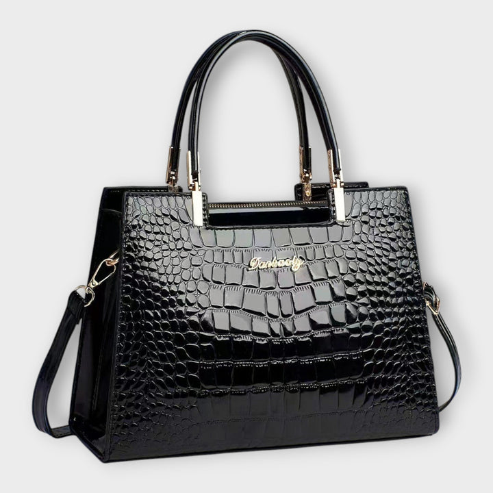 Elegant women's classic structured handbag, perfect for a chic summer look. Designer quality shoulder bag.
