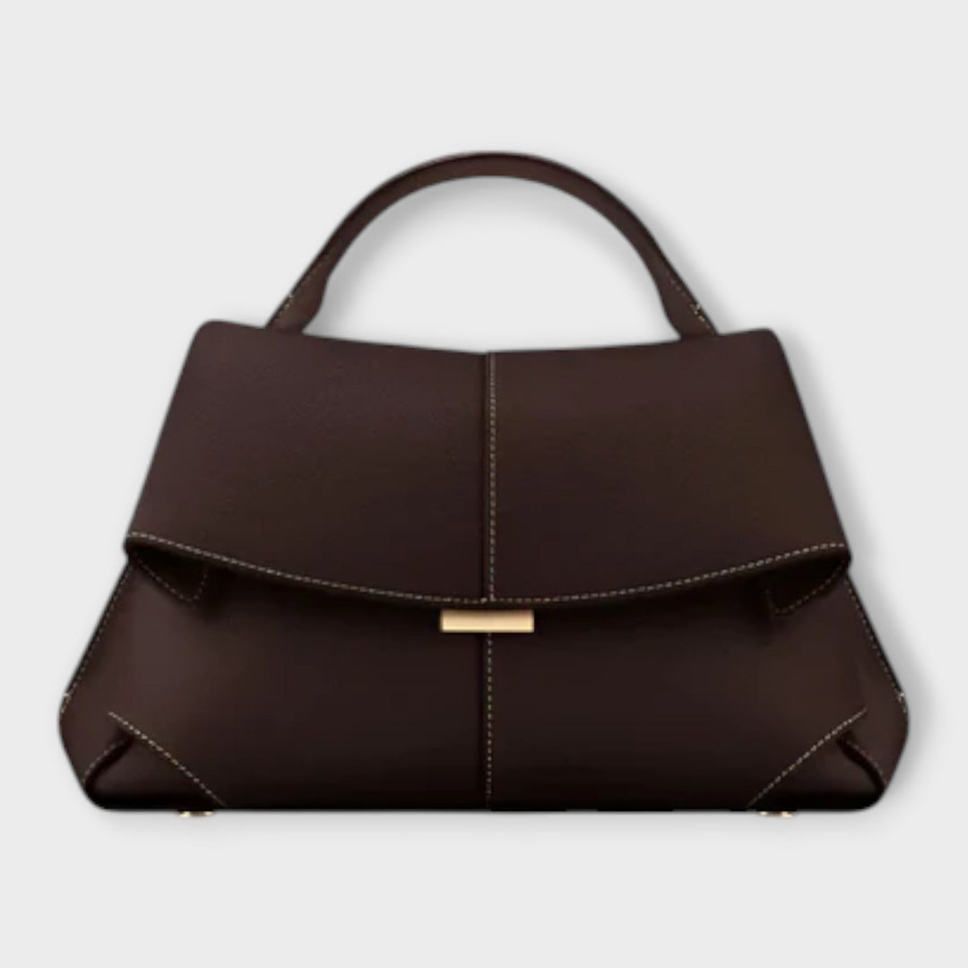 Stylish women's elegant structured handbag, a versatile accessory for any classic summer outfit.