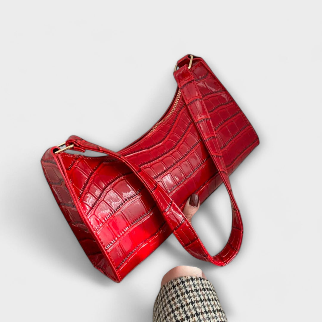Elegant women's classic textured shoulder bag with golden hardware, perfect for summer.