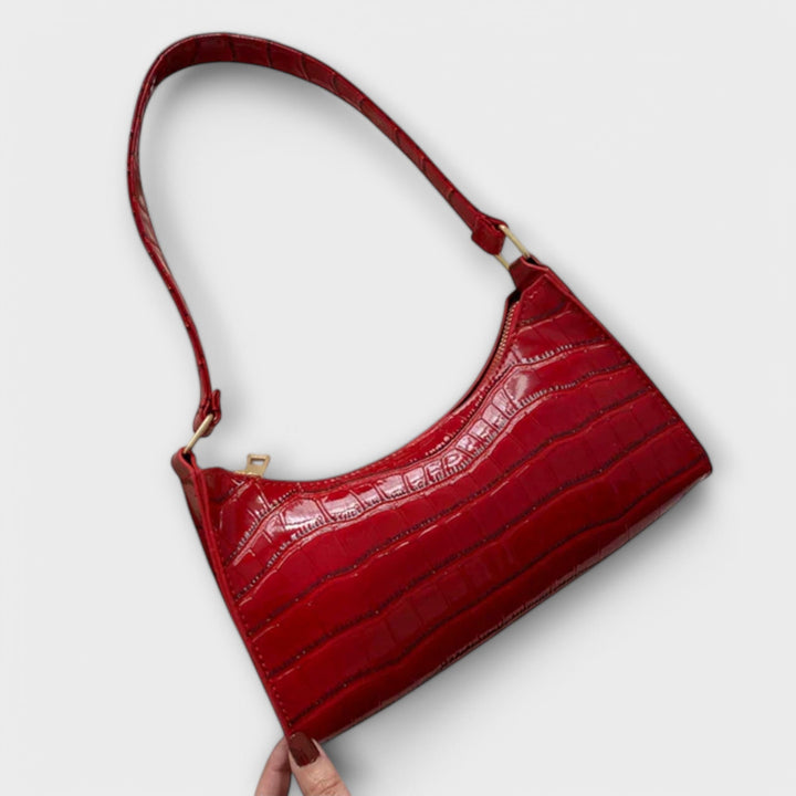 Fashion-forward women's textured shoulder bag, enhancing any look with its classic design.