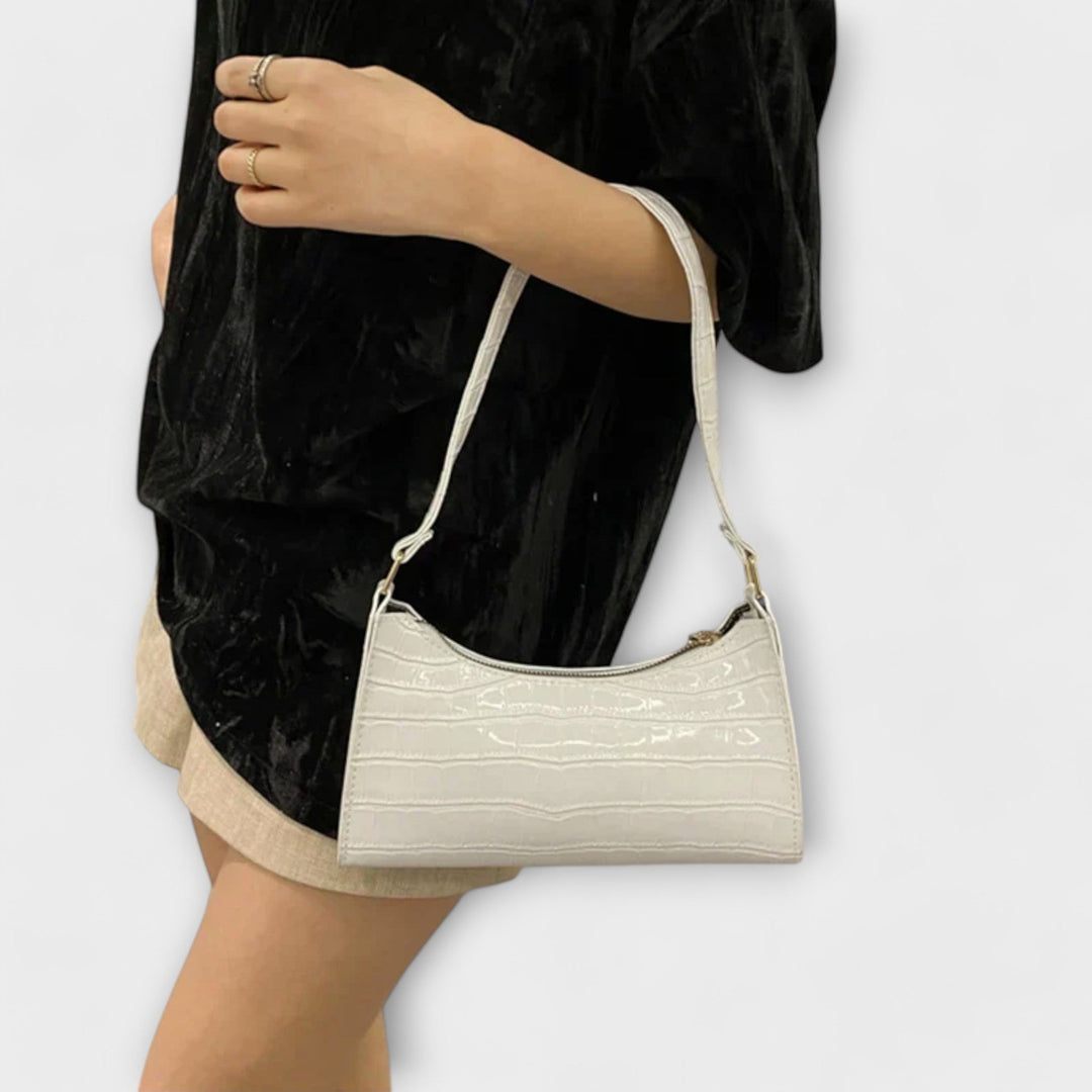 Stylish women's textured shoulder bag, ideal as an elegant accessory for any outfit.
