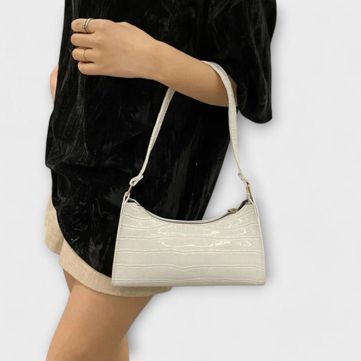 Stylish women's textured shoulder bag, ideal as an elegant accessory for any outfit.