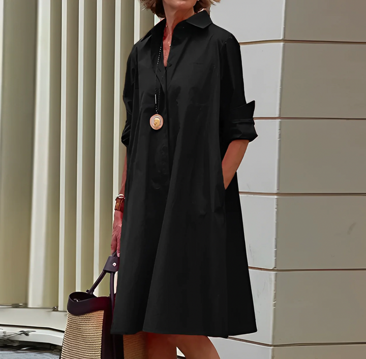 Chic women's polyester blend shirtdress with elegant button-down design.