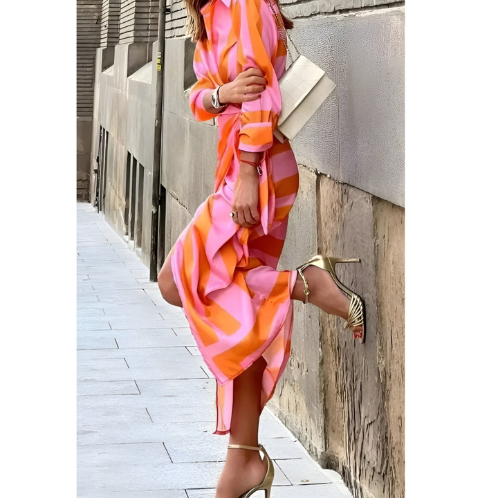 Flowy women's midi wrap dress in a vibrant print, ideal for a spring party.
