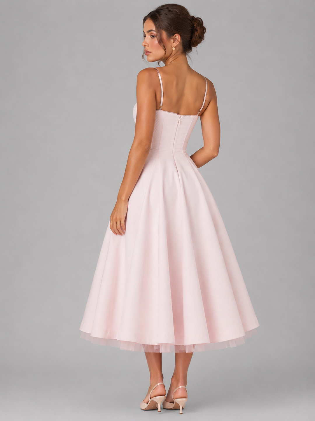 Lightweight women's full skirt midi dress with a flattering corset top. Perfect for breezy summer days and ladies' fashion.