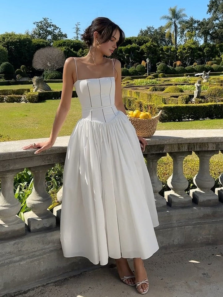 Elegant women's corset midi dress in black, perfect for a wedding guest or cocktail event.