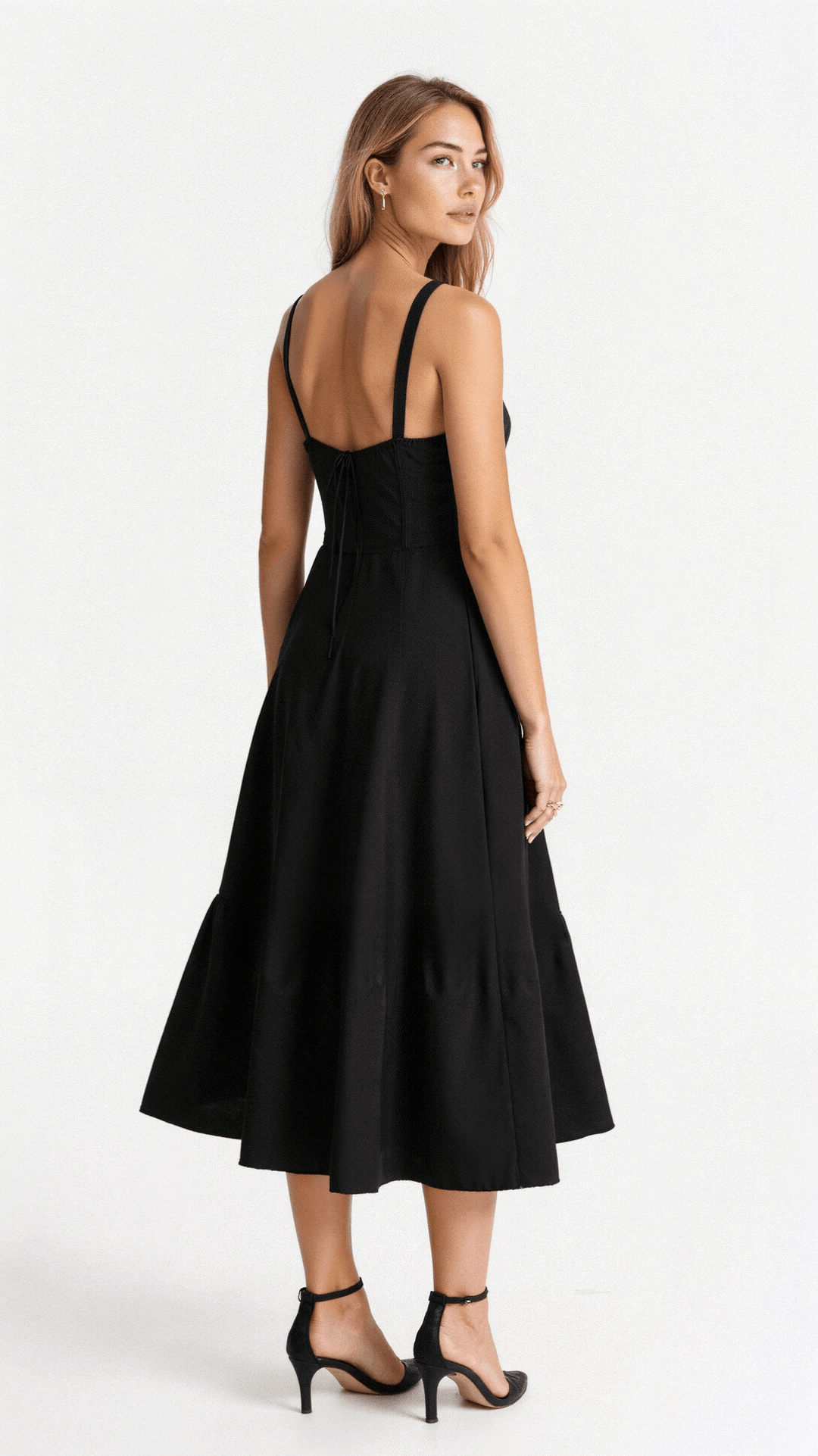 Full-length view of a women's summer midi dress, featuring a corset top and flowing skirt