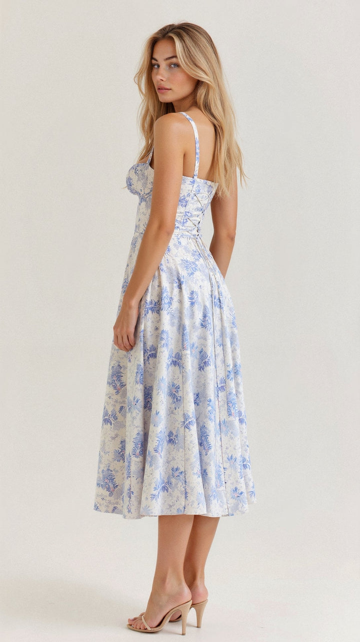 Side profile of a women's summer midi dress, highlighting the corset and flowing skirt silhouette