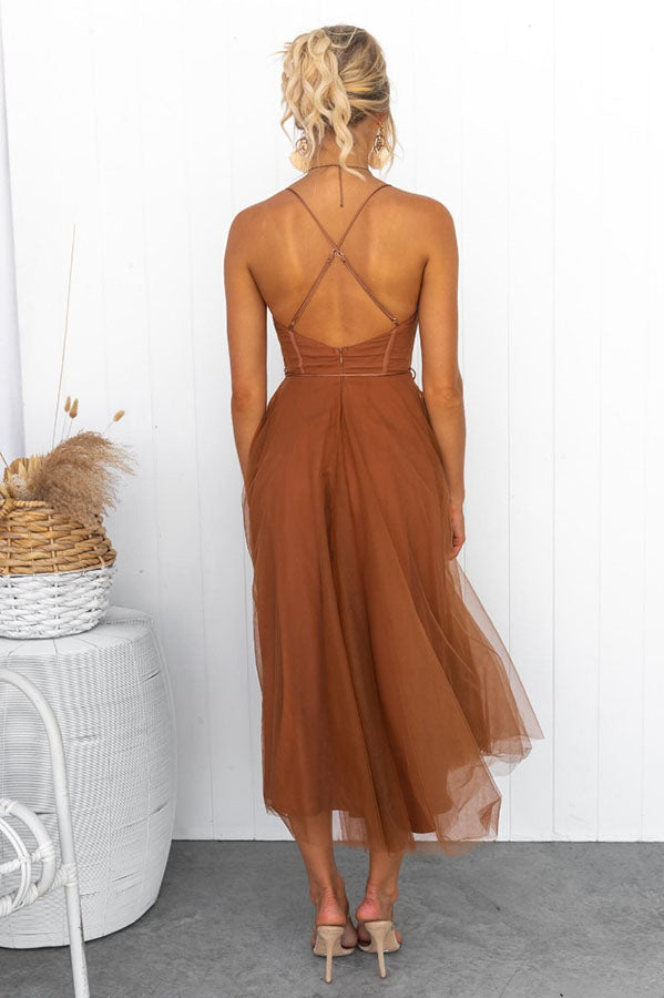Versatile women's formal dress: Corset top, midi length, and ethereal tulle skirt.