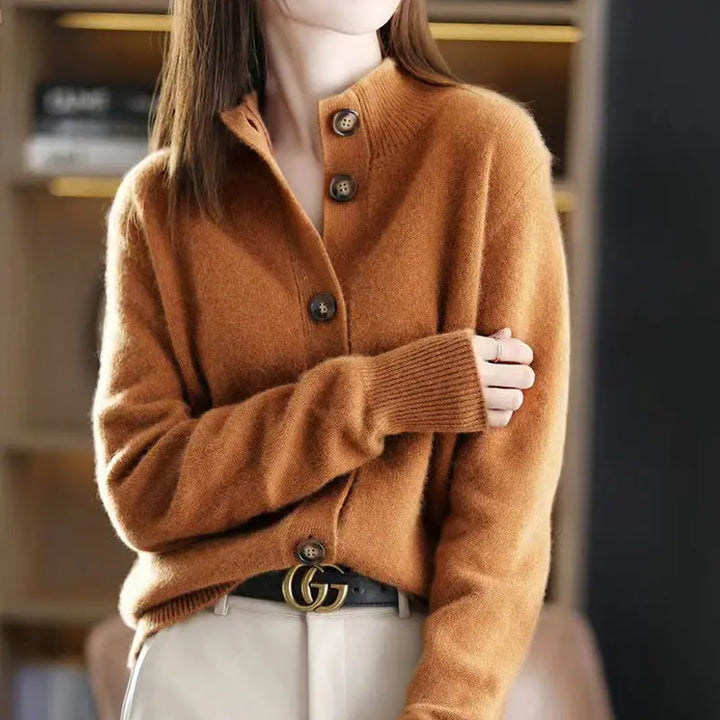 Close-up of a women's marine blue relaxed fit knit cardigan, showcasing button details and soft texture