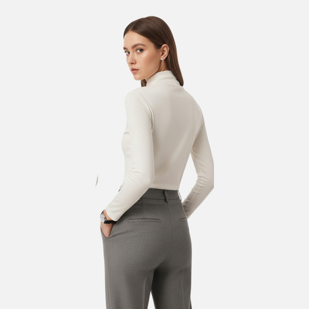 Women's elegant long sleeve top featuring a chic criss-cross neckline. Perfect for fall & winter style.