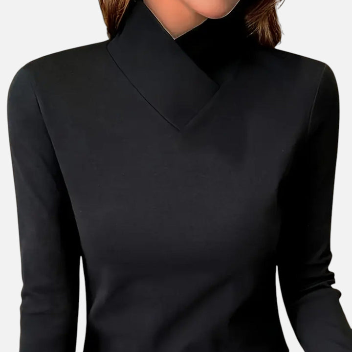 Casual yet sophisticated women's blouse with a flattering criss-cross neck and comfortable long sleeves.