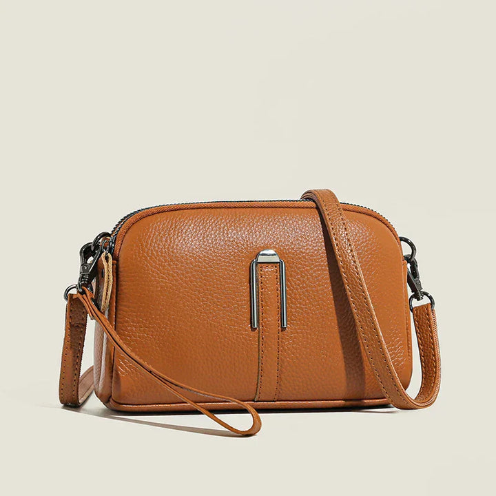 Black elegant women's crossbody bag with long strap, a versatile fashion accessory.