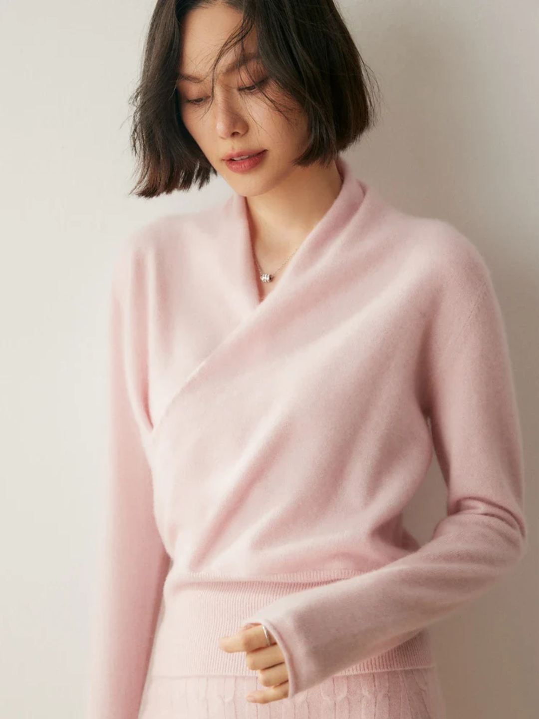 Elegant women's crossover wrap sweater with deep V-neck, perfect for winter and office wear.