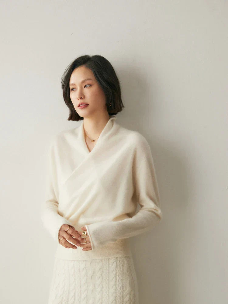 Model smiling while wearing a comfortable women's wrap sweater, great for casual wear.
