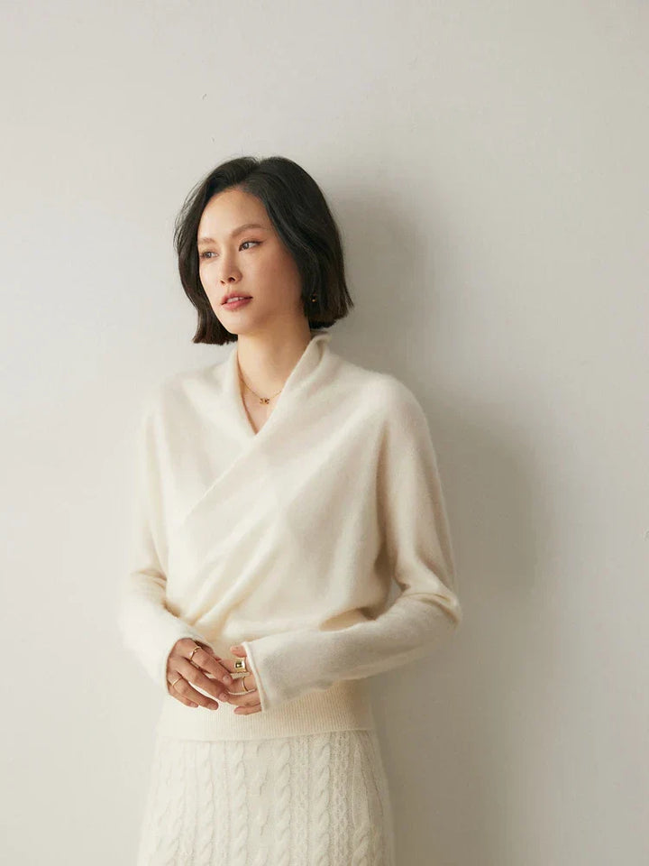 Model smiling while wearing a comfortable women's wrap sweater, great for casual wear.