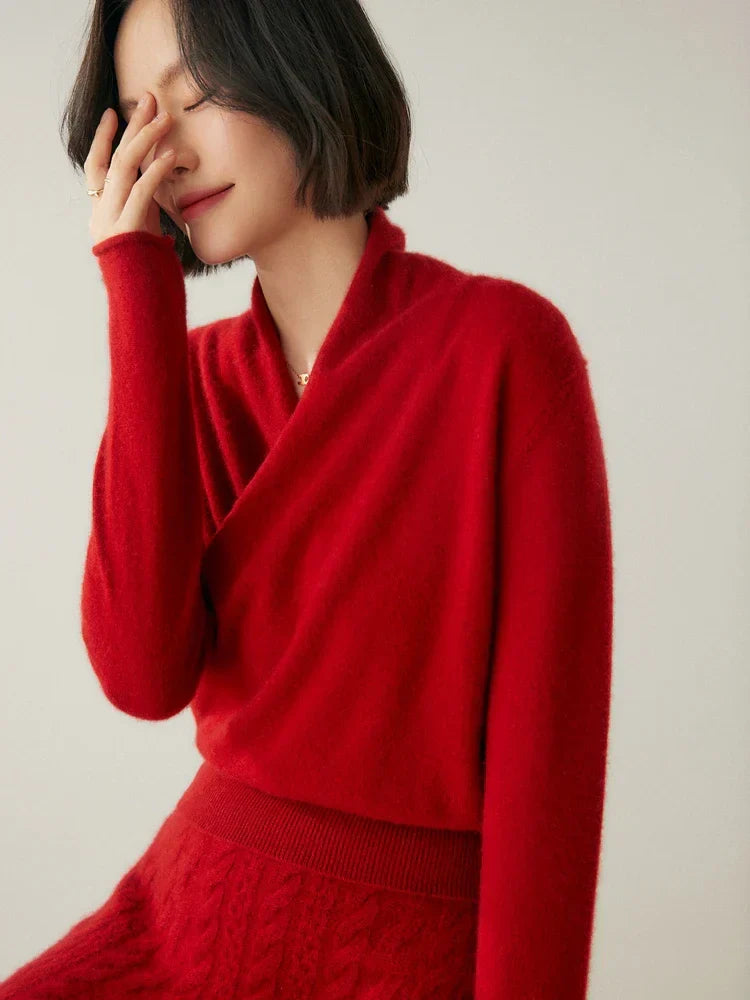 Model posing in a women's stylish grey wrap sweater, suitable for both office and casual.
