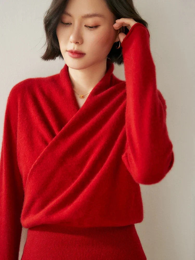 Women's elegant burgundy long sleeve wrap sweater, a staple for winter fashion.
