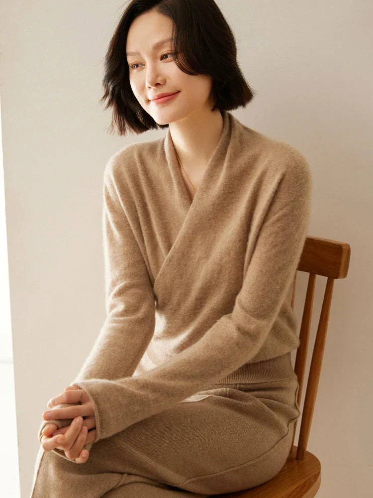 Women's elegant blue wrap knitwear, a chic option for office and evening wear.