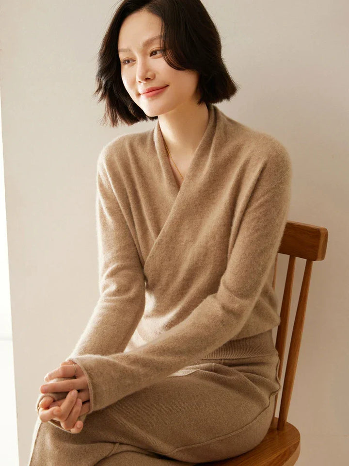 Women's elegant blue wrap knitwear, a chic option for office and evening wear.
