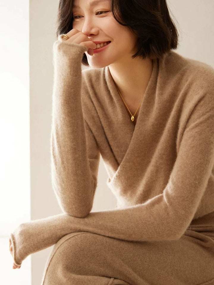 Detailed shot of the stitching on a high-quality women's crossover wrap sweater.